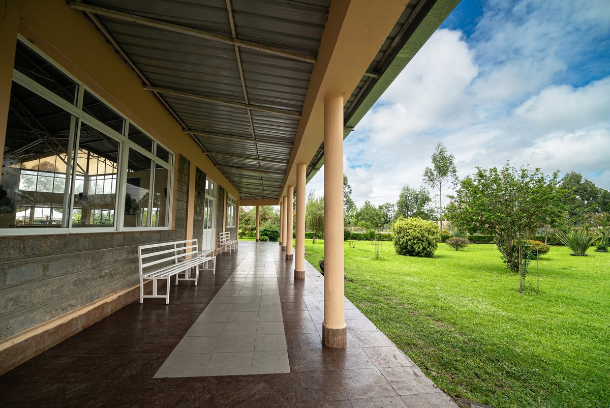 A shaded colonnade beside the lawns