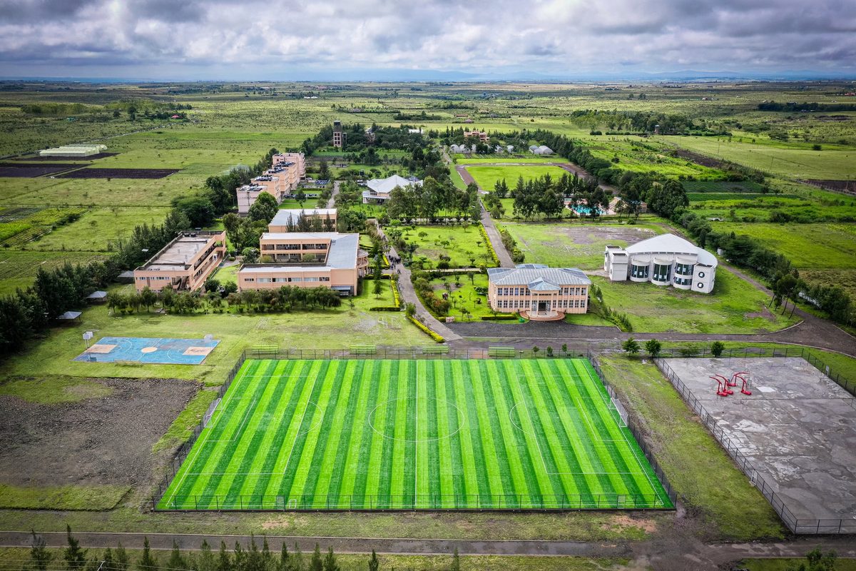 Aerial view of the Rockfields campus, its all-weather pitch and the Kajiado plains