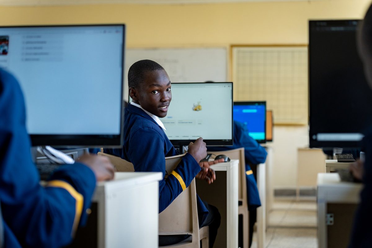 A boy at his computer in the ICT suite