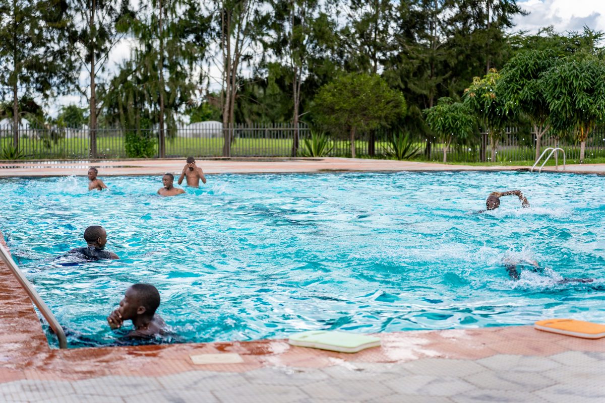 Boys swimming in the school pool